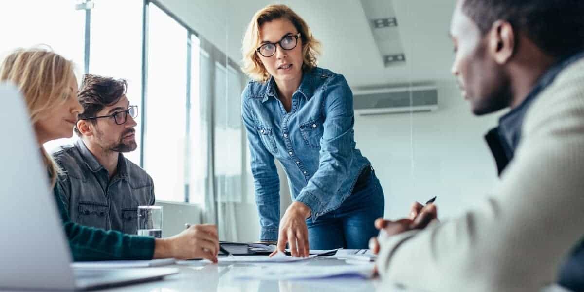 Woman pointing at project on desk