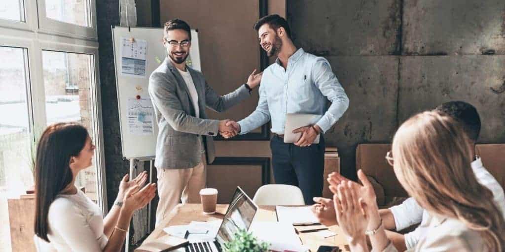 employee receiving promotion in office