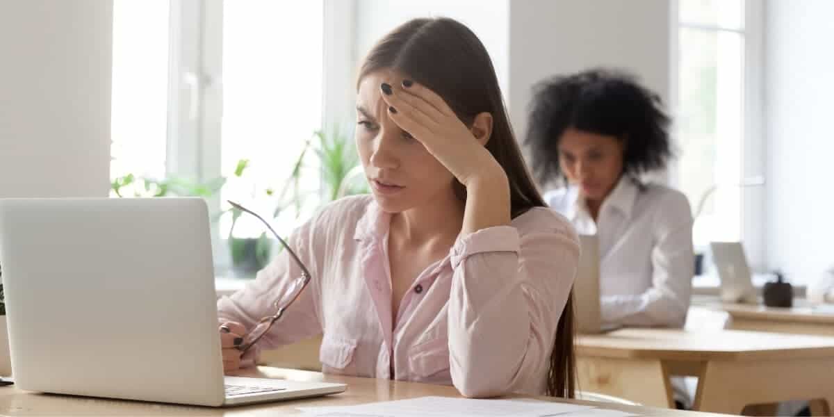 woman upset at desk