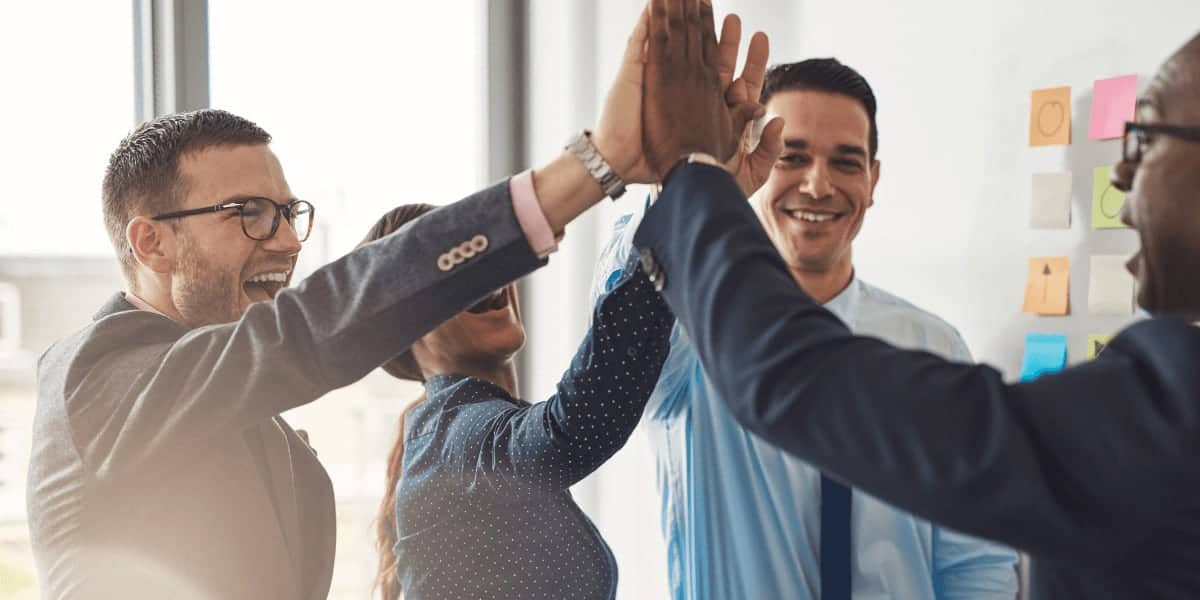 people high fiving in group