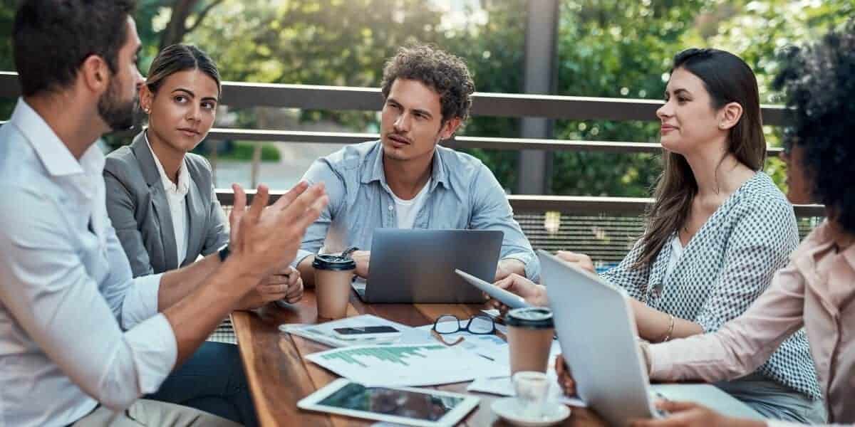 Group of coworkers together in leadership meeting