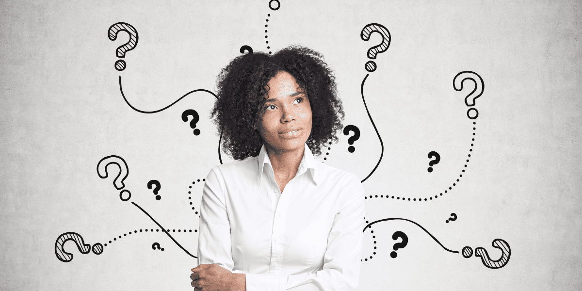 Woman thinking about questions to hire an executive coach