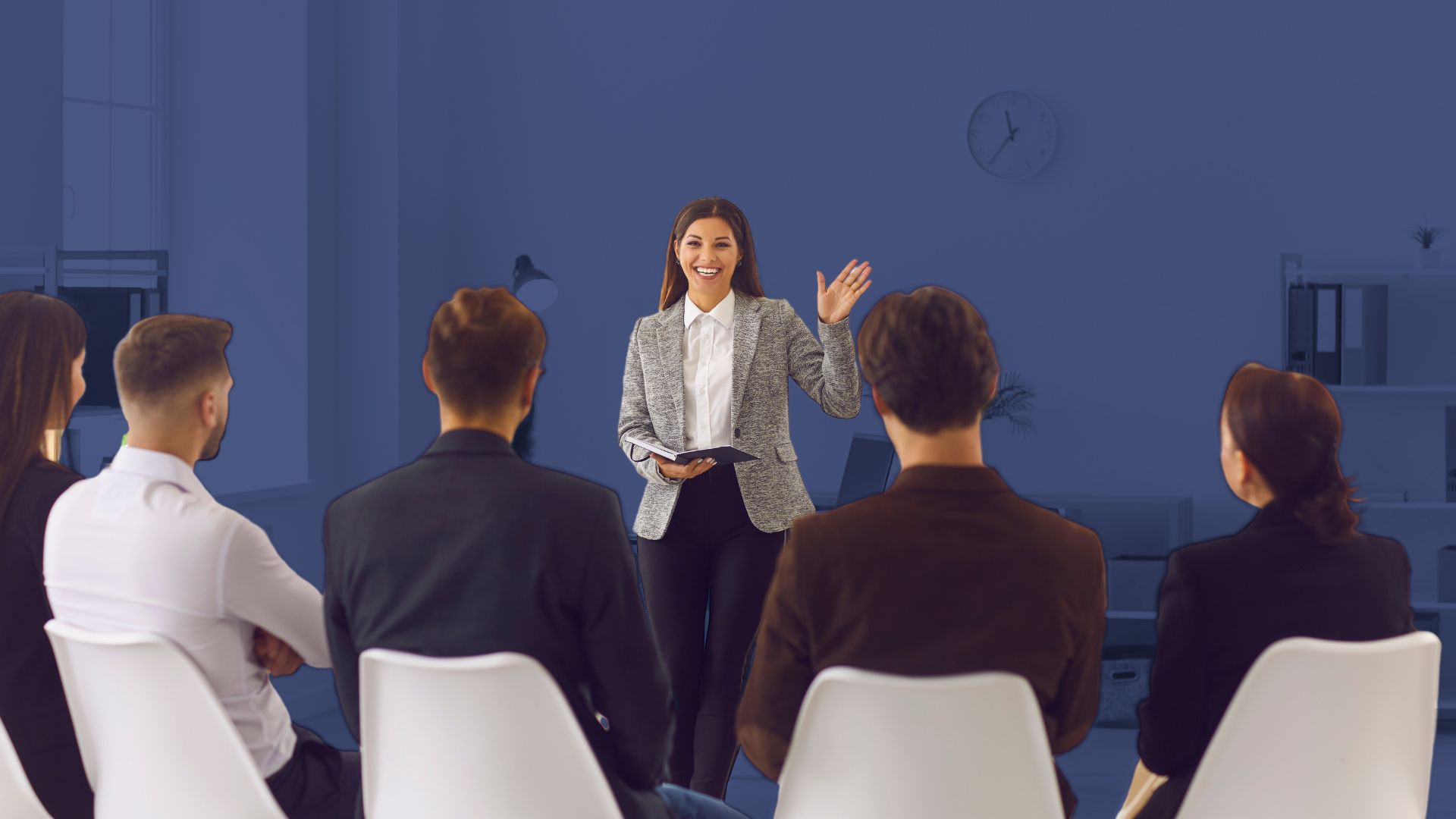 coworkers sitting at desk discussing project